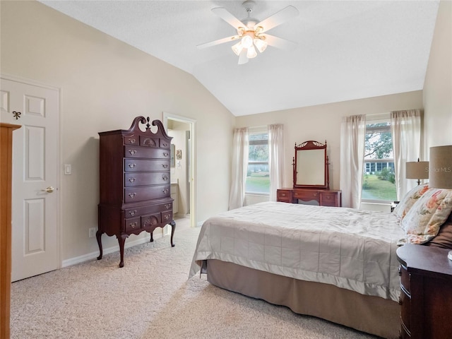 carpeted bedroom featuring ceiling fan, lofted ceiling, and multiple windows