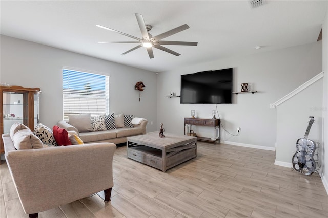 living room featuring ceiling fan