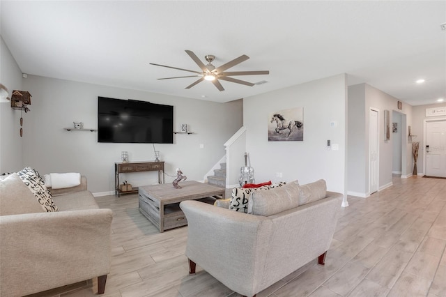 living room featuring ceiling fan