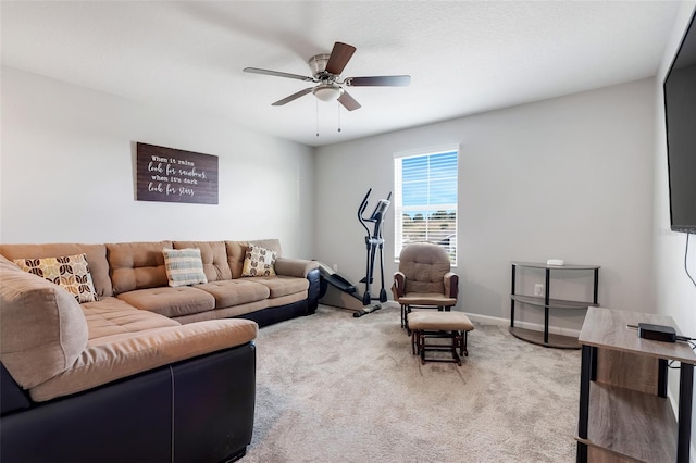 carpeted living room featuring ceiling fan