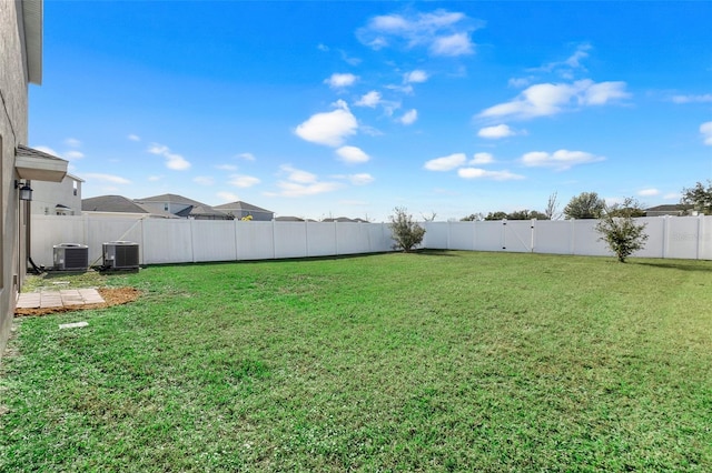 view of yard featuring central AC