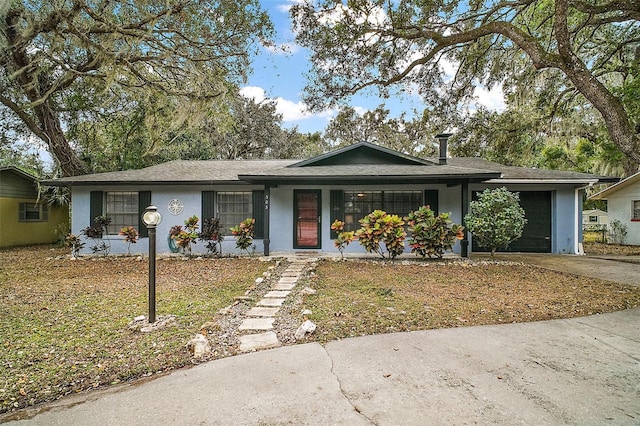 ranch-style home featuring a garage