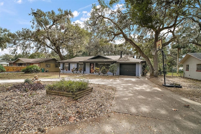 ranch-style house featuring a garage