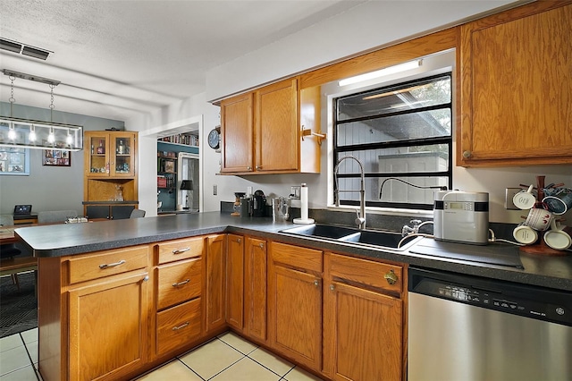 kitchen with dishwasher, sink, kitchen peninsula, decorative light fixtures, and light tile patterned floors