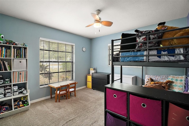 bedroom featuring ceiling fan and light carpet