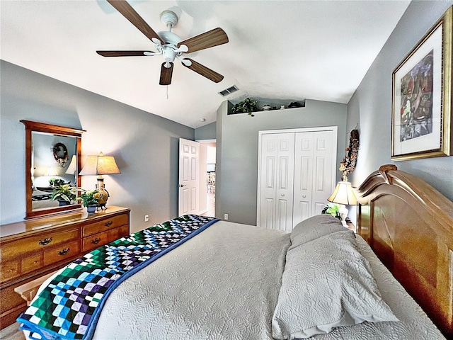 bedroom featuring a closet, ceiling fan, and lofted ceiling