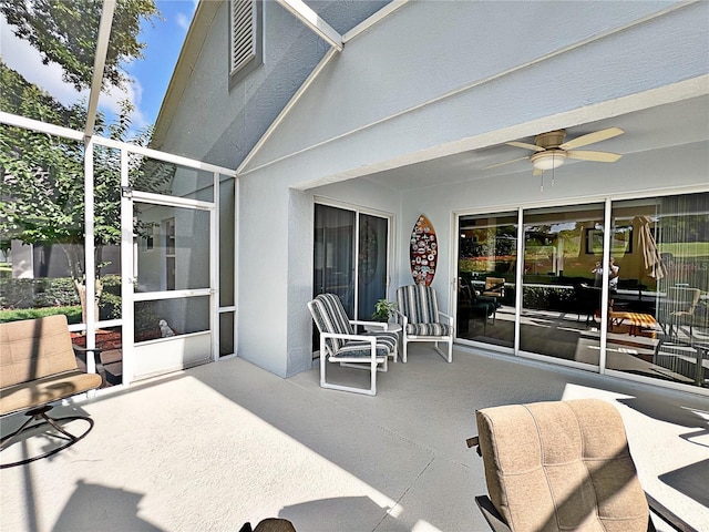 view of patio featuring ceiling fan