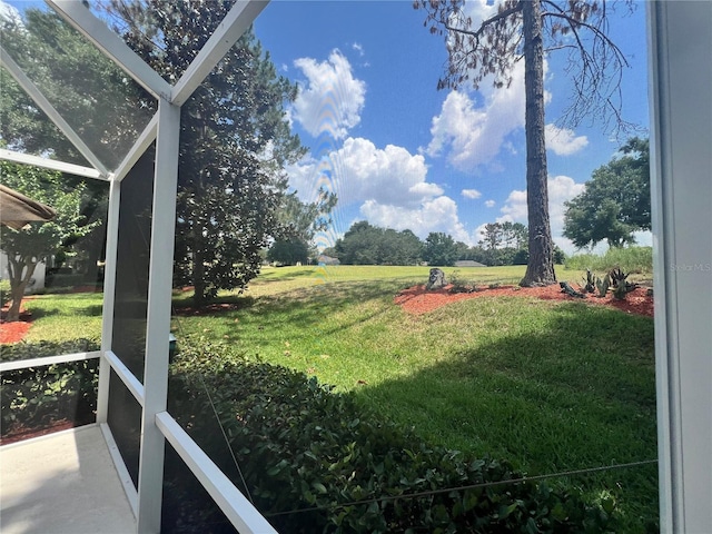 view of yard featuring a lanai