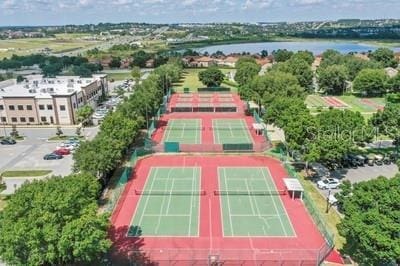 birds eye view of property with a water view