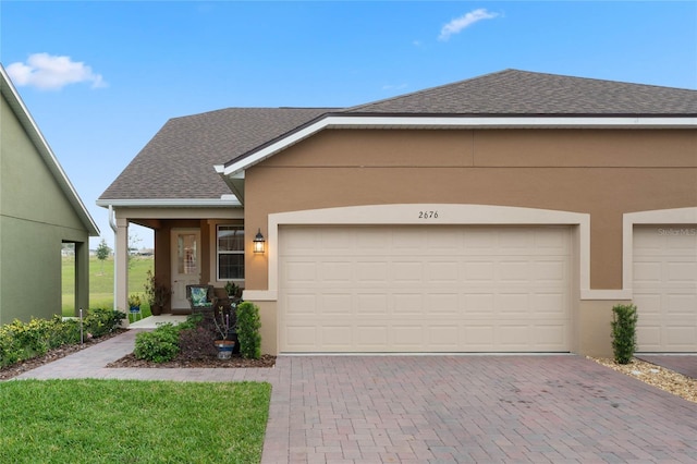 view of front of property with a garage