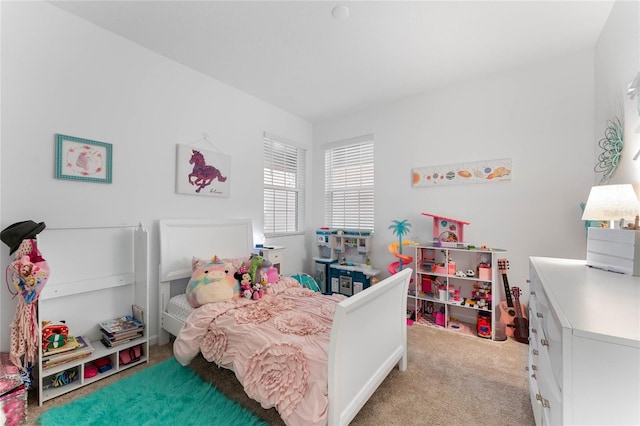 bedroom featuring light colored carpet