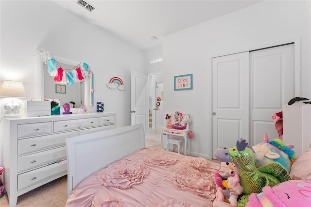 carpeted bedroom featuring a closet