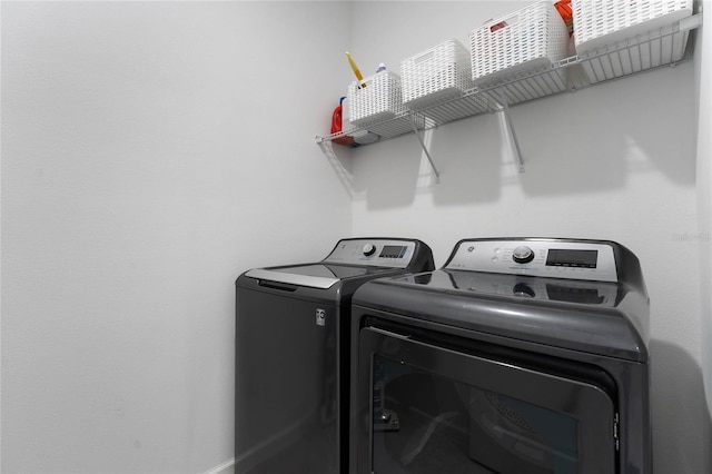 laundry room with independent washer and dryer