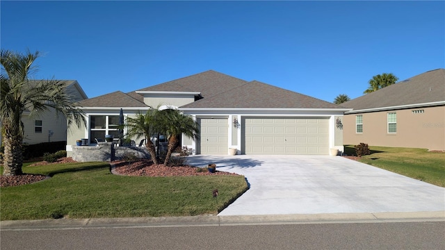 view of front of property with a front lawn and a garage