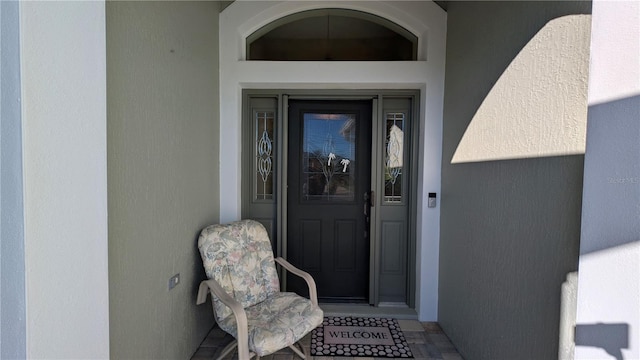 1881 Sassparilla Way, The Villages, FL 32162 - doorway to property with stucco siding