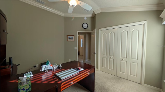 home office with carpet floors, vaulted ceiling, ceiling fan, and crown molding