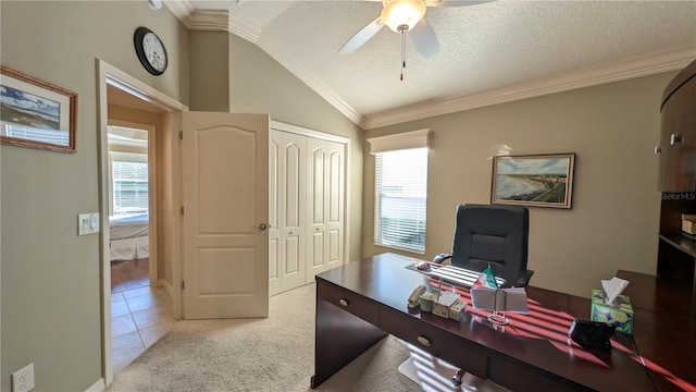 home office featuring a textured ceiling, ceiling fan, light tile patterned flooring, and lofted ceiling