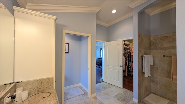 1881 Sassparilla Way, The Villages, FL 32162 - bathroom with crown molding, a tile shower, a walk in closet, and tile patterned flooring