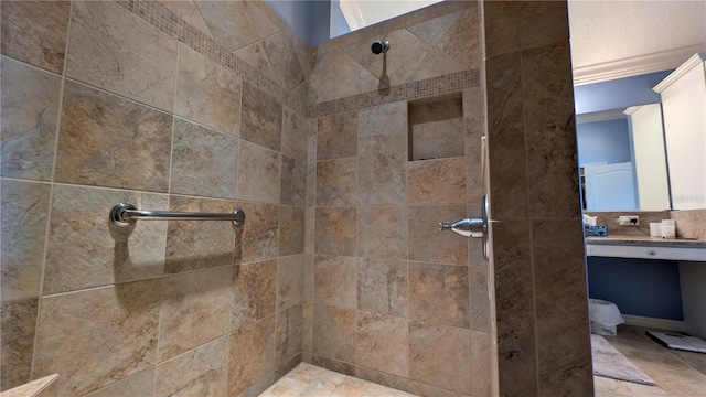 bathroom with tiled shower