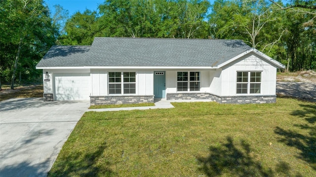 ranch-style house with a front lawn and a garage