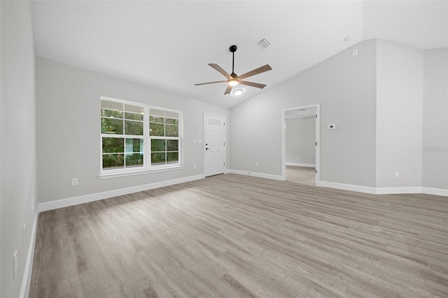 spare room featuring ceiling fan, light hardwood / wood-style flooring, and vaulted ceiling