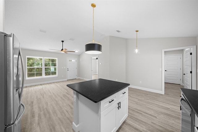 kitchen featuring appliances with stainless steel finishes, decorative light fixtures, white cabinetry, and ceiling fan