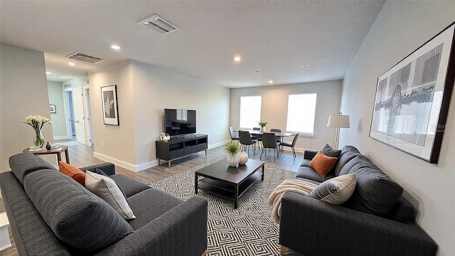 living room with light hardwood / wood-style flooring