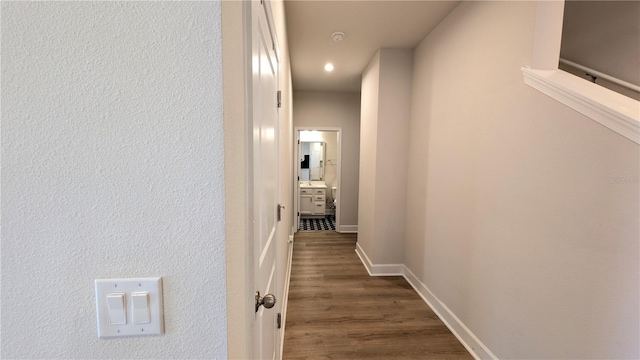 hallway featuring dark hardwood / wood-style flooring