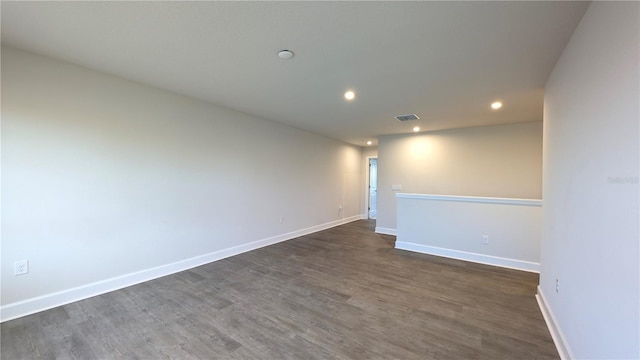 empty room with dark hardwood / wood-style floors