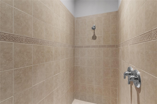 bathroom with a tile shower