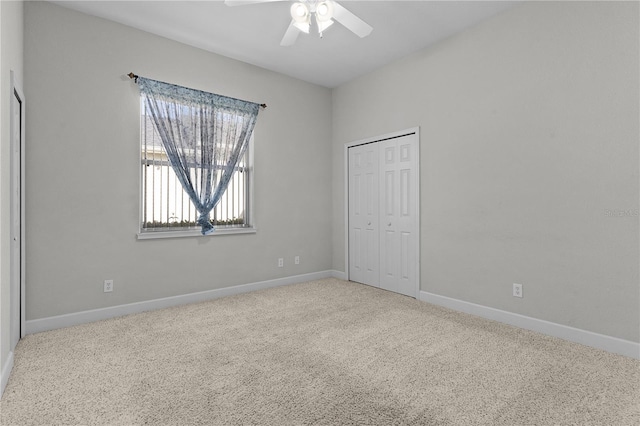 unfurnished bedroom featuring ceiling fan, carpet floors, and a closet