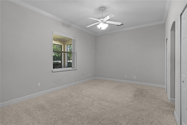 carpeted empty room with crown molding and ceiling fan