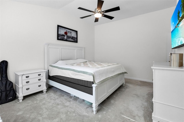 bedroom with light carpet and ceiling fan