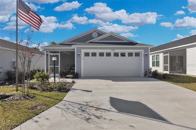 view of front of house with ceiling fan and a garage