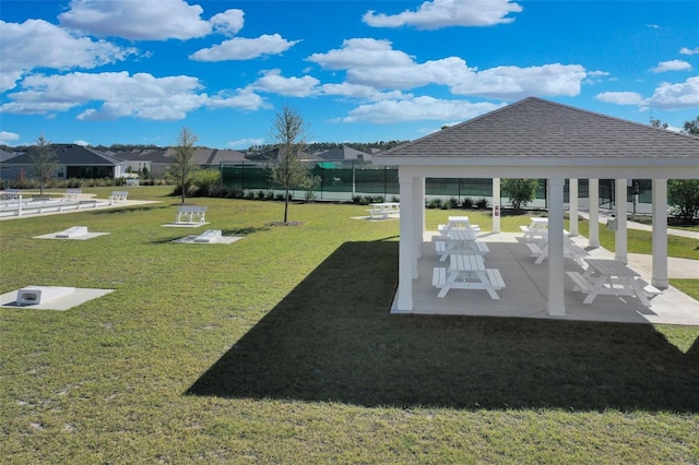 surrounding community featuring a lawn, a patio area, and a gazebo