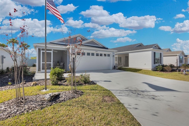 single story home with a garage and a front lawn