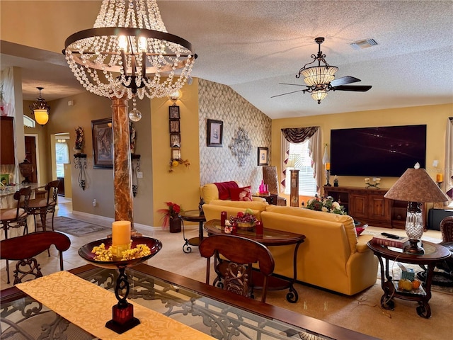 living room with ceiling fan with notable chandelier and lofted ceiling