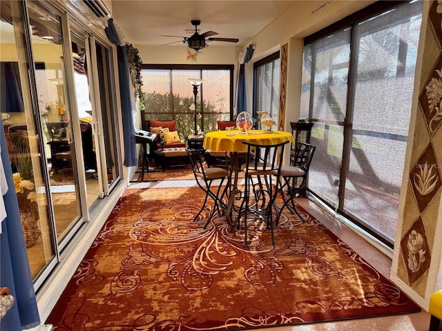 sunroom featuring ceiling fan