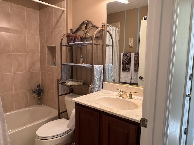 full bathroom featuring vanity, shower / bath combination with curtain, and toilet