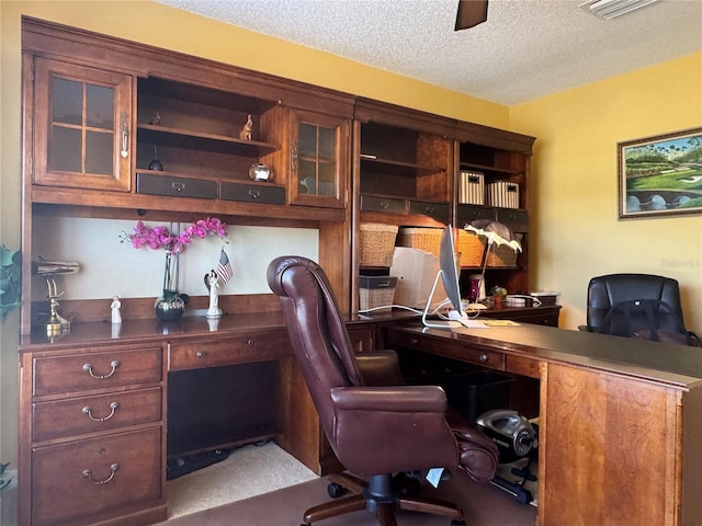 office area with a textured ceiling