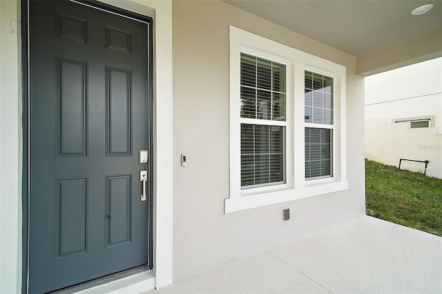 doorway to property featuring covered porch