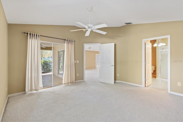 unfurnished bedroom featuring connected bathroom, access to exterior, vaulted ceiling, light carpet, and ceiling fan with notable chandelier