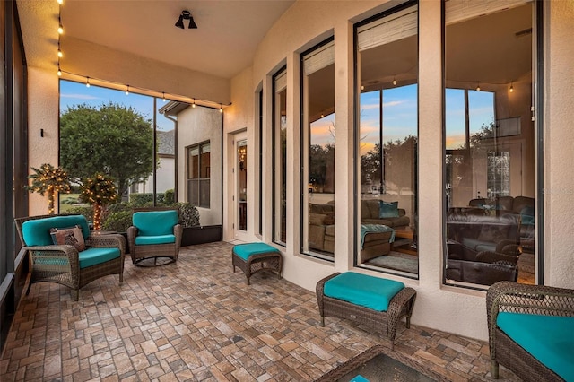 view of patio terrace at dusk