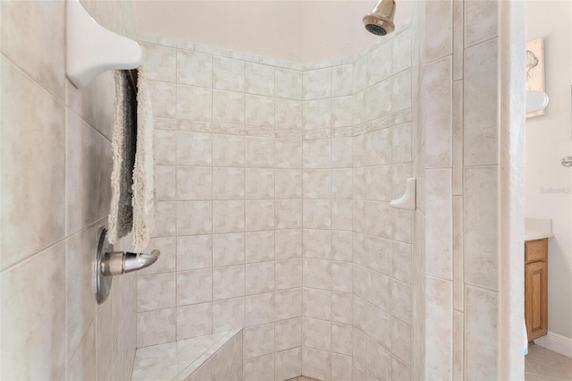 bathroom with vanity and tiled shower