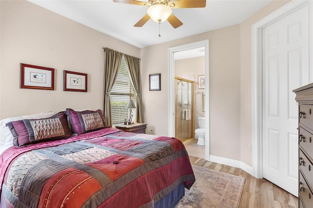 bedroom with connected bathroom, ceiling fan, and light hardwood / wood-style floors