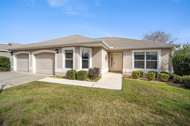 ranch-style house with a garage and a front yard