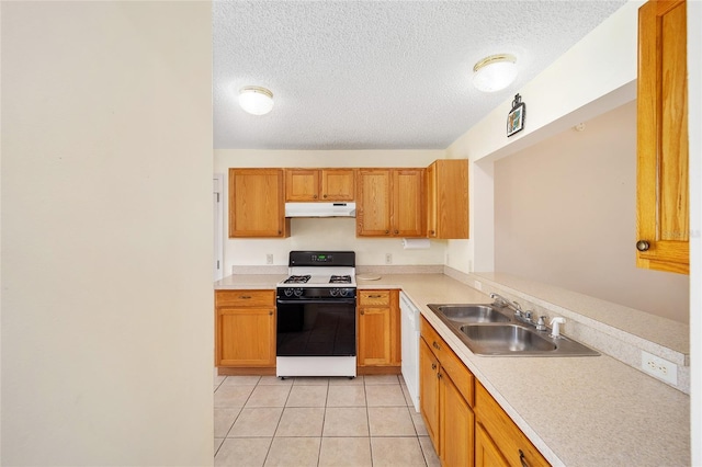 kitchen featuring a textured ceiling, sink, light tile patterned flooring, and white appliances