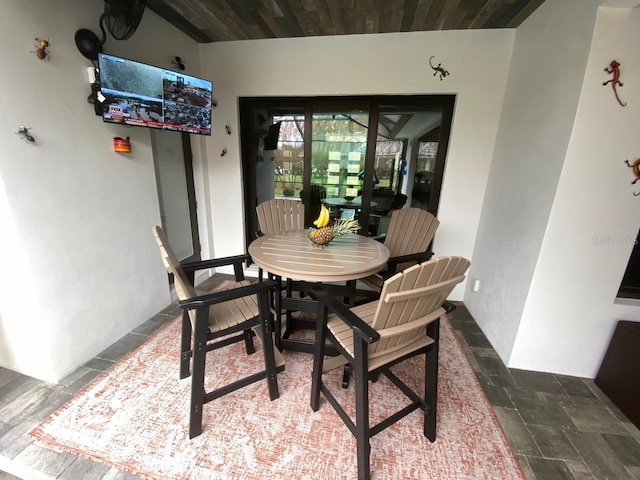 dining space featuring wooden ceiling