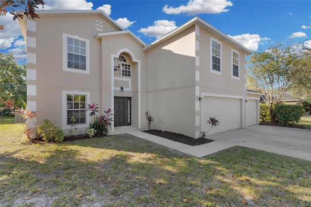 view of front of property featuring a garage and a front lawn