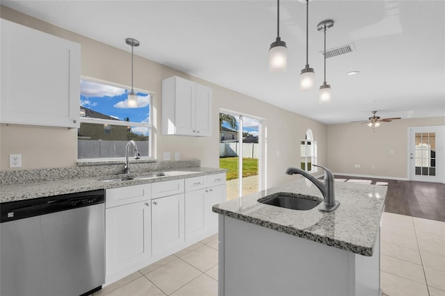 kitchen featuring stainless steel dishwasher, ceiling fan, white cabinetry, and sink